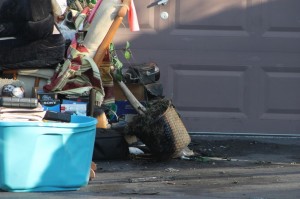 Several items damaged by fire sit outside the Oswin Turn home Wednesday. (Tom Sofield/LevittownNow.com)