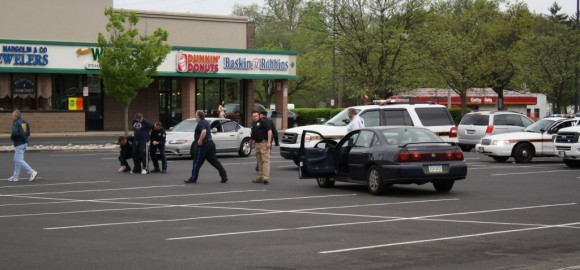 Police moments after taking Phillip into custody with their guns drawn in April 2011. Credit: Tom Sofield/LevittownNow.com