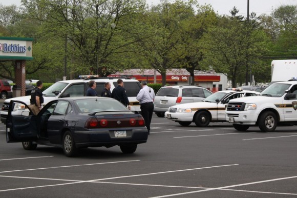 Police leading the then-48-year-old man to a waiting patrol car. Credit: Tom Sofield/LevittownNow.com