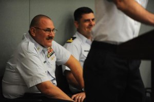 Coast Guard Master Chief Petty Officer Michael Jones (left) laughs during his retirement ceremony Friday, May 24, 2013, at Naval Station Mayport, Fla., as a peer tells stories about his time working with Jones. Jones joined the Coast Guard May 11, 1983, at the age of 17 with his mother's permission and worked his way up the ranks as a machinery technician. Credit: U.S. Coast Guard photo by Petty Officer 1st Class Lauren Jorgensen)