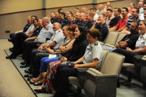 Family members, friends and peers of Coast Guard Master Chief Petty Officer Michael Jones laugh as they listen to stories from his 30-year Coast Guard career during his retirement ceremony at Naval Station Mayport, Fla., May 24, 2013. Credit: U.S. Coast Guard photo by Petty Officer 1st Class Lauren Jorgensen