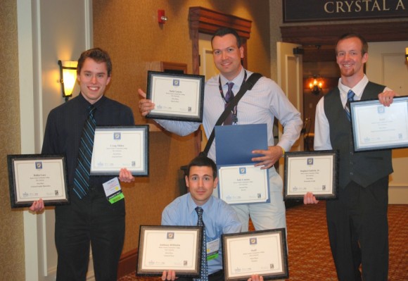Bucks County Community College students show off a portion of the dozen awards the Centurion student newspaper won in the 2013 Student Keystone Press Award contest, sponsored by the Pennsylvania Newspaper Association Foundation. Since 2010, the Centurion has won 48 awards in the two-year college division. Honorees included (left-right) Craig Miller of Langhorne, Seth Canata of New Hope, Stephen Godwin, Jr. of Warminster, and (front) Anthony DiMattia of Yardley. Credit: Bucks County Community College