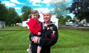 Penndel resident Machinist's Mate First Class Stephen Rush with his daughter, Evaline, at Saturday parade.  Credit: Tom Sofield/LevittownNow.com
