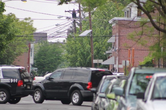 The row home where the situation is unfolding is on the right with the awnings, a police officer said. Credit: Tom Sofield/LevittownNow.com