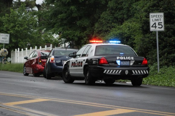 A Middletown police officer responding to a minor two-vehicle crash on Woodbourne Road Wednesday afternoon. Credit: Tom Sofield/LevittownNow.com
