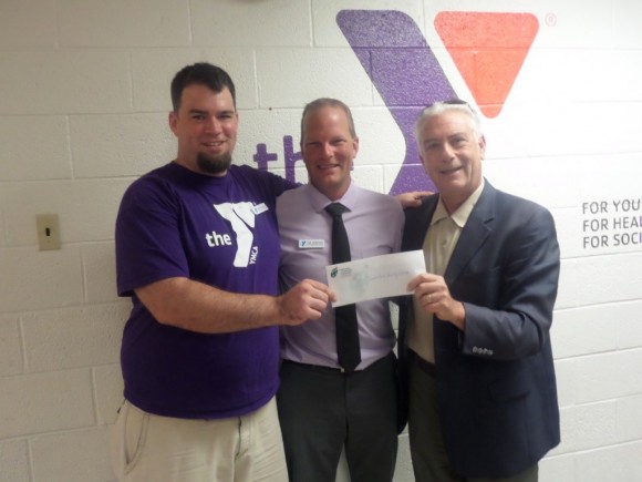 Ron Bernstein, Executive Director of Foundations Community Partners, presents a check for $10,000 to (from left) Jonathan Salyer, Special Abilities Coordinator at the Lower Bucks Family YMCA, and Tom Swanciger, Chief Operations Officer at the Lower Bucks Family YMCA.  Credit: Lower Bucks County YMCA