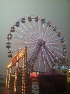 The LED-lit Ferris wheel at St. Michael's Fair Thursnday night as storms rolled through the area.  Credit: Chris Reif/Submitted