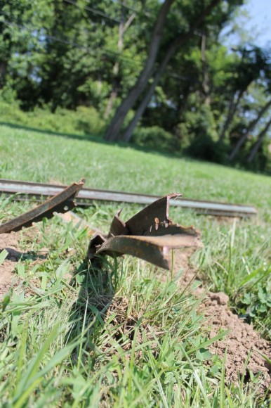 A piece of the street sign destroyed in the accident. Credit: Tom Sofield/LevittownNow.com