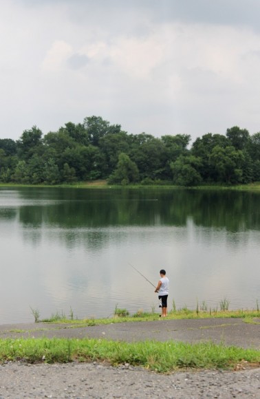 A boy fishing at Levittown Lake in Tullytown on a recent morning. Credit: Tom Sofield/LevittownNow.com
