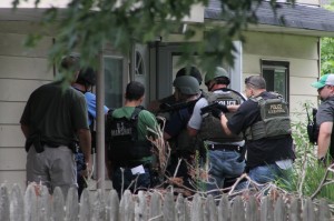 US Marshals move in of 10 Border Rock Road in Levittown to take down one of the state's most wanted men on Wednesday afternoon. Credit: Tom Sofield/LevittownNow.com