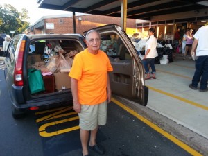 Richard Amadio, 84, packs his car with necessities Monday night. Credit: Dave Sommers/LevittownNow.com