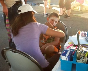 A child sits to have his face painted by volunteers at the Dairy Delite S.A.F.E event. Credit: Amanda Kuehnle/LevittownNow.com