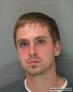 Submitted: Christopher Ehlinger in a mugshot from his prior conviction in 2009