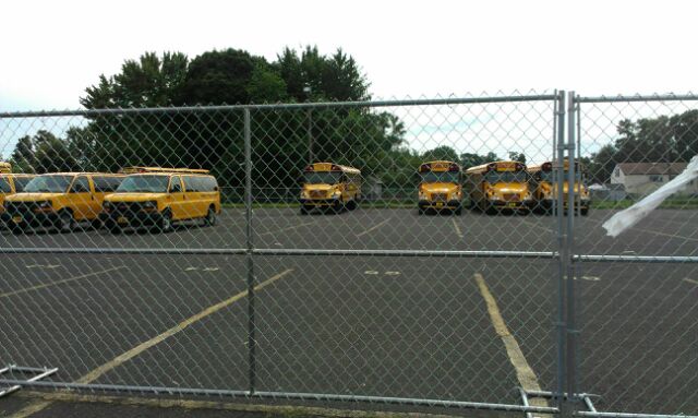 Buses Now Behind Fence, Permanent Home Still Sought