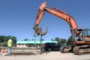 Crews work on removing a portion of the concrete road surface in Bristol Township in 2013. Credit: Tom Sofield/LevittownNow.com