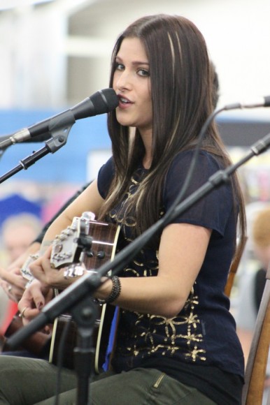 Singer Cassadee Pope performs a song Wednesday evening at the Levittown Walmart in Tullytown. Hundreds of people showed up for her performance and autograph signing. Credit: Tom Sofield/LevittownNow.com