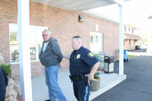Police leading McKavanagh into District Court moments after his ex-wife asasulted a reporter. Credit: Tom Sofield/LevittownNow.com