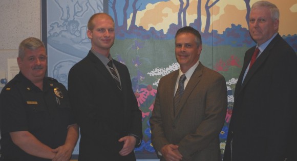 Officer Timothy McNulty (second from left) after being sworn in. Credit: Middletown Township