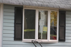 No trespassing signs in the front window of the home. Credit: Tom Sofield/LevittownNow.com