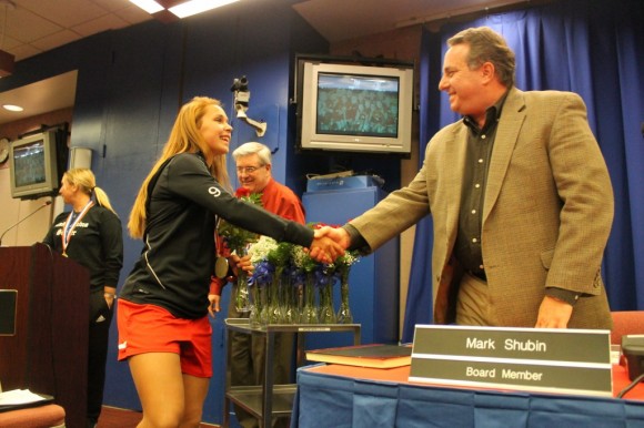 Neshaminy School Board member Mark Shuban shakes hands with one of the high school soccer players who helped win the state championship last week. The girls bested the Spring-Ford girls soccer team Hersheypark Stadium. Credit: Tom Sofield/LevittownNow.com