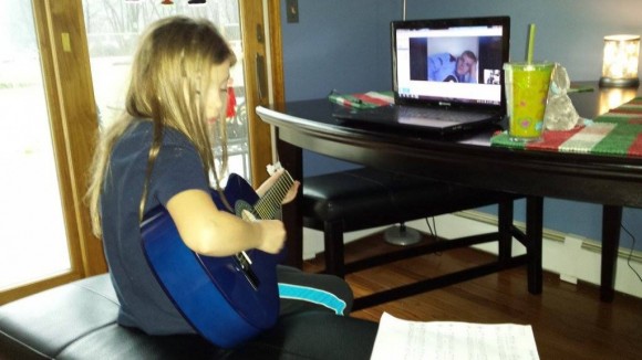 Seana plays guitar for her father. Credit: Tom Sofield/LevittownNow.com