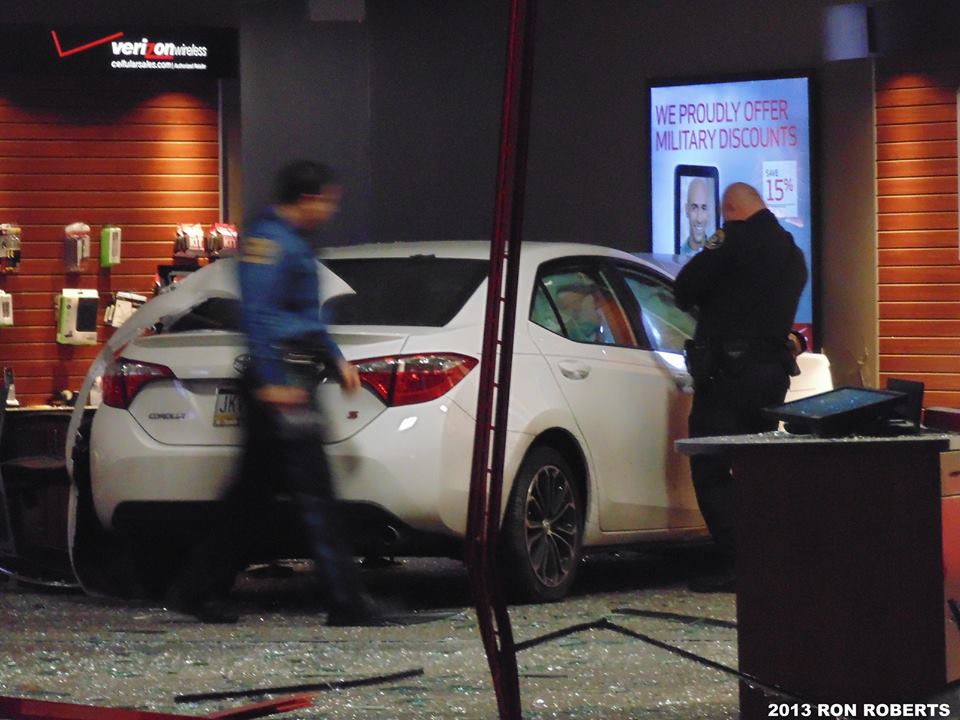 Vehicle Goes Through Verizon Storefront at Queen Anne Plaza