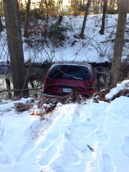 A minivan came to rest in the canal off Magnolia Drive in the Levittown section of Falls Township. No further information about the accident was available as of press time.  Credit: Vernae Harvey/Submitted