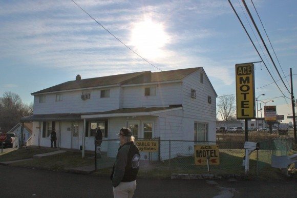 Bystanders outside the motel watching police. Credit: Tom Sofield/LevittownNow.com