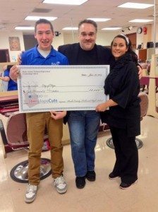 Shane White presents a check to City of Hope officials Harry Giordano. Cosmetology instructor Brandee Baker is on the right. Credit: Submitted