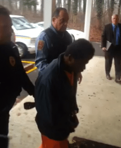 Marcel Johnson being lead into court Friday afternoon. Credit: Erich Martin/LevittownNow.com