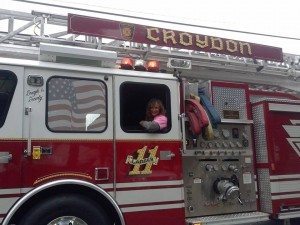 Councilwoman Longhitano at the twp Christmas Parade riding with the Croydon Fire Company Credit: Jeff Bohen LevittownNow.com