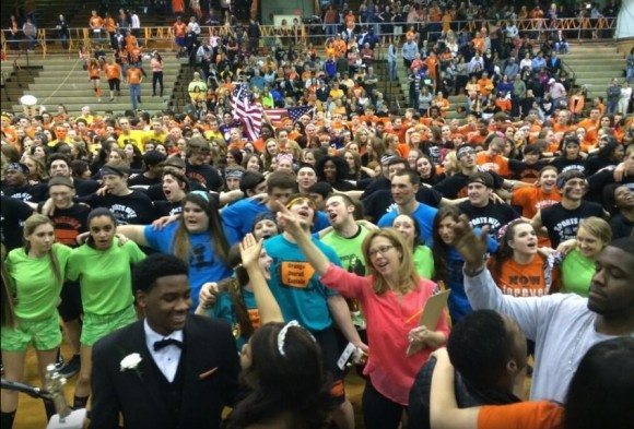 This shot depicts closing ceremonies on Saturday at the conclusion of Pennsbury's Sports Nite. Everyone is singing the Pennsbury Alma Mater in unison. The woman in the center is Physical Education teacher, Patricia Merrick, one of the organizers of this year's Sports Nite. Credit: Pennsbury School District