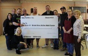 Ride for Dime presents a check for $700 to the Bristol Borough Area Active Adult Center on Saturday April 6. Credit: Ride for Dime