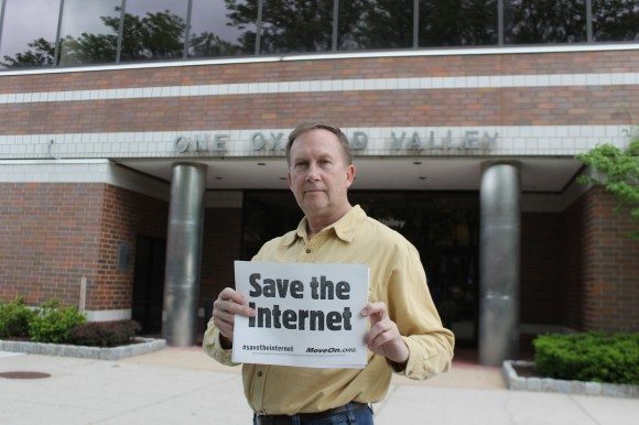 A small group of protestors stood outside One Oxford Valley, which houses the local FCC offices. The move came as the FCC voted to end an end to "net neutrality." Internet Service Providers will now have the ability to offer faster access to certain content providers, which protestors said could raise prices. Credit: Tom Sofield/LevittownNow.com