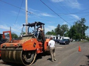 Councilman Craig Bowen checks how paving work is moving along.  Image Credit: Jeff Bohen  LevittownNow.com 