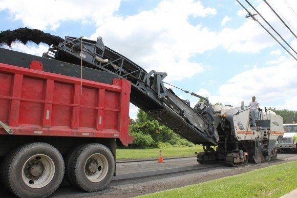 Crews working on Mill Creek Road, just past Green Lane, on Friday as crews strip old pavement from the road surface. Credit: Tom Sofield/LevittownNow.com