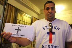 Mike Rago handed out envelopes as people left services. Credit: Tom Sofield/LevittownNow.com