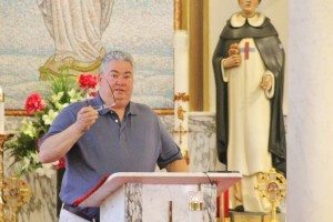 Ralph DiGuiseppe speaking at a St. Ann mass in 2014.  Credit: Tom Sofield/LevittownNow.com