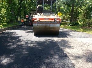 Crews pave a road in Bristol Township. File photo