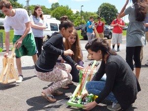 Jayti Bhavsar, Rachel Custer and Valeria Ochoa set up their Shrek-inspired catapult for launch. (Students pictured from L-R) Credit: Bristol Township School District