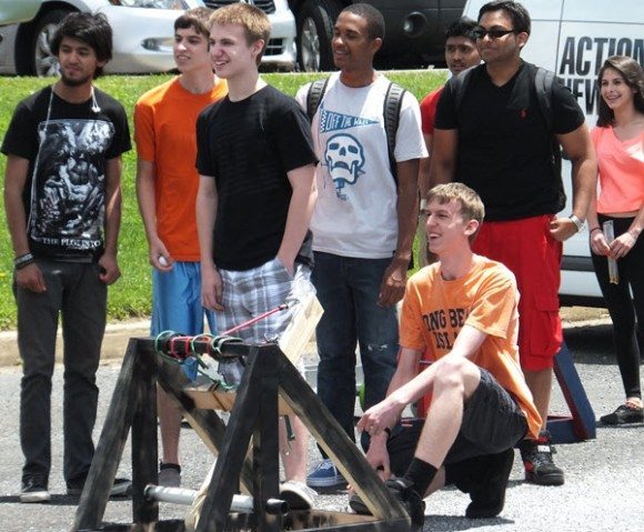 Students prepare to launch a marble from their catapult. Credit: Bristol Township School District