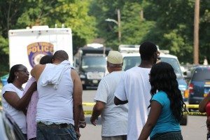 The family of Tyrone Moss arriving at the scene.  Credit: Tom Sofield/LevittownNow.com
