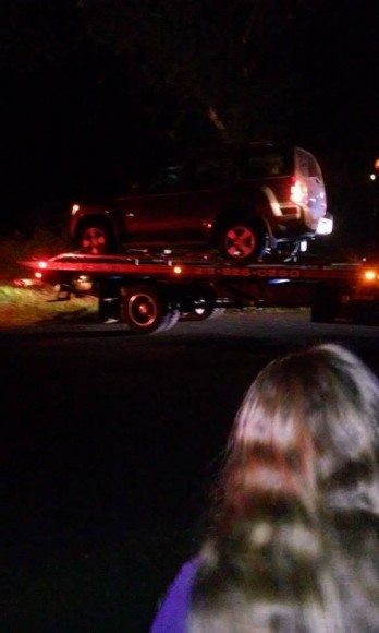 A tow truck removing the car involved in the chase. Credit: Christy Martini-Waite/Submitted