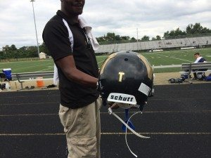 The Wardogs who lost 'Coach T' in June, now proudly wear a 'T' symbol on their helmets in honor of him. Credit: Constance Moore
