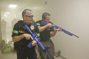 Middletown Sgt. Pete Feeney clears a hallway with Penndel Chief of Police Joseph Sciscio. Credit: Tom Sofield/LevittownNow.com