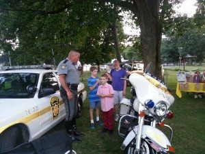 State Trooper answers inquires from children and parents at the national Night Out Event in Morrisville on Tuesday night  Image Credit: Jeff Bohen LevittownNow.com 
