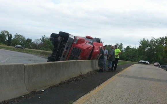 A truck hauling waste crashed on the Route 13 ramp that exits onto Tyburn Road in Falls Township around 3:45 p.m. Wednesday. First responders were called and the driver was treated for a minor injury, according to an official. Only the truck was involved.  Credit: Dave Brews