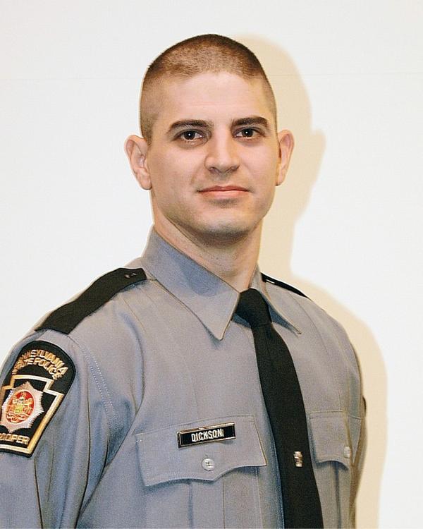 Thousands Gather for State Trooper’s Funeral as Manhunt Continues