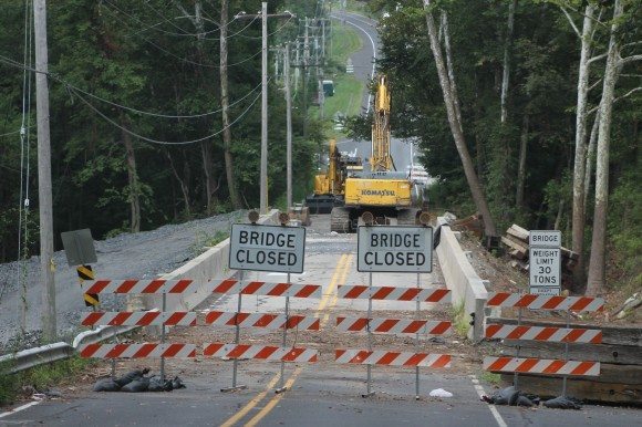 Crews at work Monday taking down the West Maple Avenue bridge that connects Middletown and Lower Southampton.  The 60-year-old West Maple Avenue bridge will remain closed for up to two years until the $7.3 million dollar reconstruction project is finished. The new bridge is expected to keep the same arch-style design but take advantage of new construction techniques that require less annual maintenance to the span. Credit: Tom Sofield/LevittownNow.com