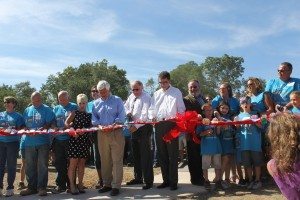 Officials cut the ribbon on the new playground. Credit: Tom Sofield/LevittownNow.com